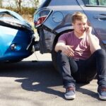 man sitting on the floor after an accident