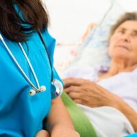 elder person in hospital bed