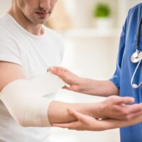 man with injured arm